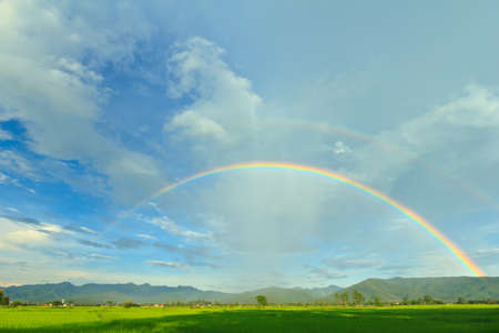 Rainbow on blue sky and clouds in tropical.の写真素材