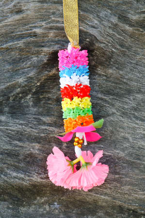 Garland made of plastic on wood.の写真素材