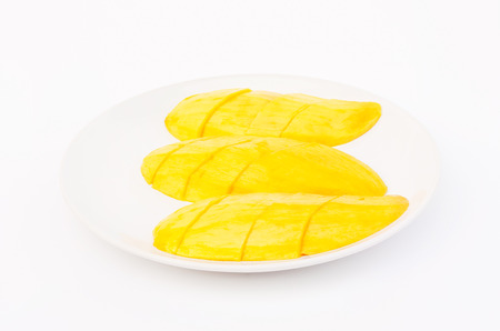 The ripe mangoes,peeled cut into slices ready to eat.の写真素材