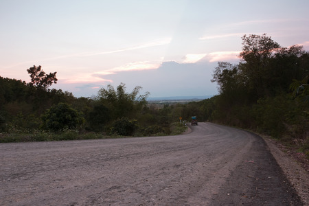 Sunset,looking on the road,which is a rural road in Thailand.の写真素材