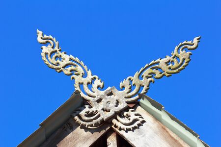 Thai architecture.Kalae is the name of the wooden component,which is on the house roof in northern Thailand.の写真素材