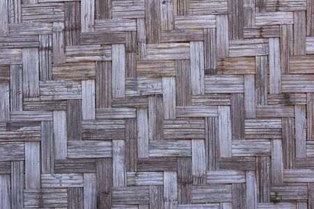 Bamboo wall.The house wall is made of bamboo.Wall of plaited bamboo strips.の写真素材