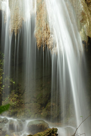 Flowing water of the waterfall  at Nam Min Waterfall Forest  Park in Northern Thailand.の写真素材