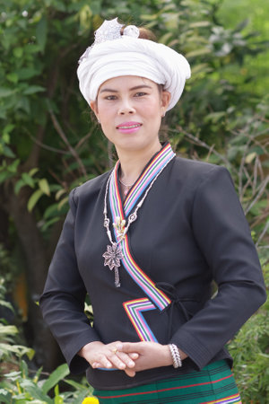 Phayao, Thailand - March 11, 2017 : Unidentified portrait of one Tai Lue ethnic woman is posing for a photographer to commemorate their New Year's occasion.のeditorial素材