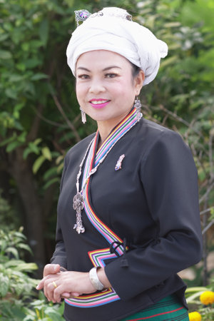 Phayao, Thailand - March 11, 2017 : Unidentified portrait of one Tai Lue ethnic woman is posing for a photographer to commemorate their New Year's occasion.のeditorial素材
