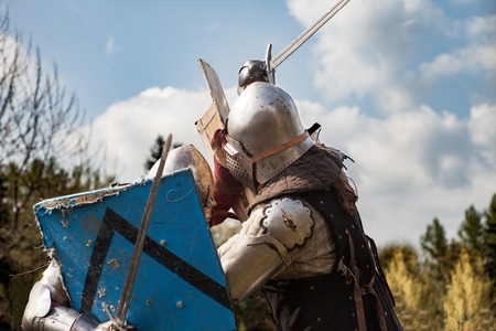 Knight tournament. The knights in the congregations are fighting in the ring. Public event in the city. Soldiers in armor of the Middle Ages.のeditorial素材