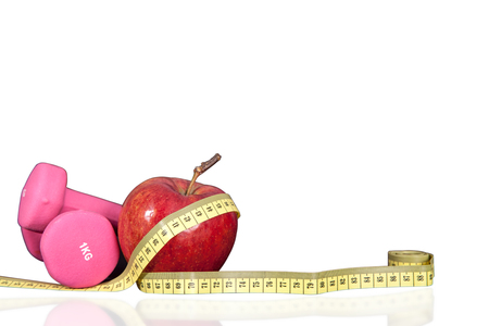 Fruity cocktail with fruit in a shaker. Small dumbbells for exercise and meter. Composition fitness drink and fruit on a white background.のeditorial素材