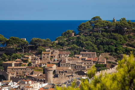 View of the old town of Tossa de mar one of the most beautiful city on the Costa Brava. City walls and medieval castle on the hill. Amazing city in Girona, architecture and monuments of Catalonia.のeditorial素材