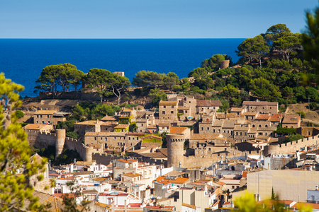 View of the old town of Tossa de mar and castle on the hill. Architecture Costa Brava of Catalonia.のeditorial素材