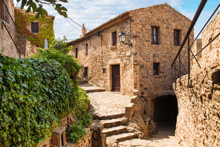 Old town of Tossa de mar. Medieval buildings next to the castle. City and old fortifications. Narrow streets and monuments in the beautiful Catalan city on the Costa Brava.のeditorial素材