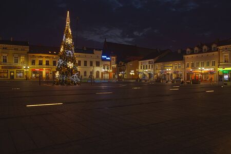 Oswiecim, Poland - December 24, 2017: The main square of the city at night. Tenements around the main square. Meeting place for people, the central point of the city. Architecture in Oswiecim.のeditorial素材
