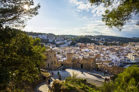 View of the city of Tossa de Mar from the castle hill. Fragments of the defensive walls of the old town of La Vila Vella. Architecture and buildings of the Catalan city on the Costa Brava.のeditorial素材