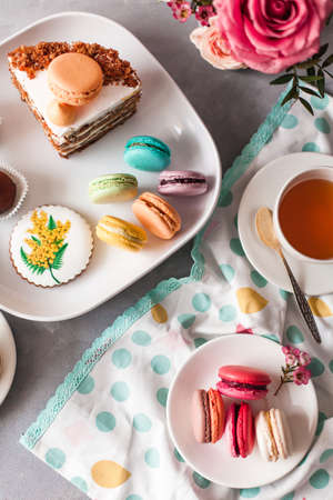 sweet macaron flowers roses rose cheesecake berries tea cup morningの写真素材