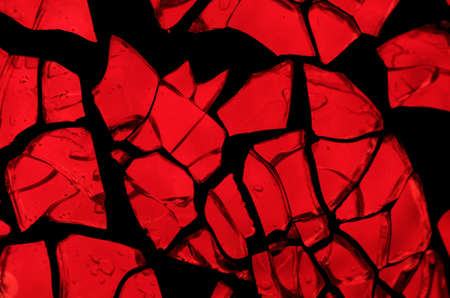 Random mosaic: pieces of vivid red backlit glassの写真素材