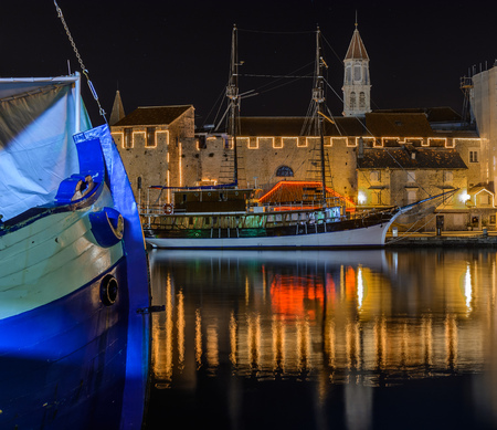 Dalmatian old town Trogir and boats at night, Croatia.の写真素材
