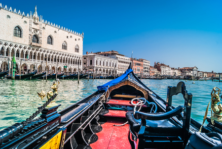 Waterfront view at cityscape of Venice from gondola in Adriatic sea.の写真素材