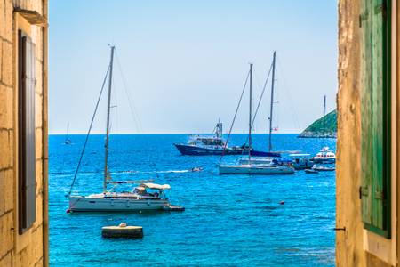 Mediterranean scenery in Komiza old town, Island Vis in Croatia.の写真素材
