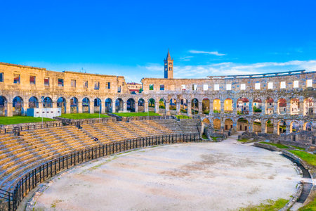 A stunning view of the historic ruins of the Roman amphitheater in Pula, showcasing its well-preserved ancient architecture and cultural significanceの写真素材