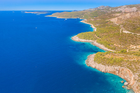 Aerial view of Brusje, a charming village on Hvar Island, Croatia, showcasing its traditional stone houses, and scenic Mediterranean landscape overlooking the Adriatic Seaの写真素材