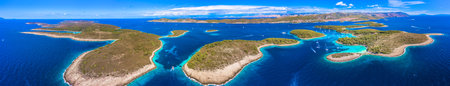 A breathtaking panoramic view of the Pakleni Islands with Hvar in the background, showcasing the...