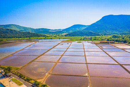 Aerial view of the ancient saltworks in Ston, Croatia, the oldest in Europe, showcasing its geometric salt pans, and stunning landscape, capturing the rich heritage of this placeの写真素材