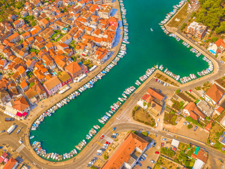 A beautiful aerial view of Stari Grad, one of the oldest towns in Croatia, located on Hvar Island, showcasing its historic stone buildings, picturesque harbor, and Adriatic Seaの写真素材