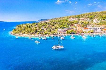 A vibrant summer view of Hvar, one of the most famous tourist destinations in Croatia, showcasing...