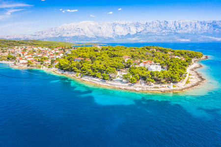Drone view of Sumartin, a picturesque coastal village on Brac Island, Croatia, captures the charming...