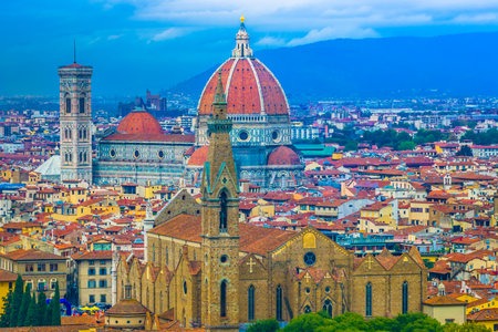 Aerial view of the historic center of Florence, Tuscany, Italy, featuring Renaissance domes and towers, and the Arno River weaving through the heart of this timeless Italian cityの写真素材