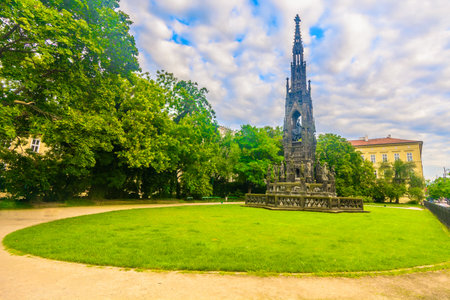 Vibrant park in the center of Prague with green lawns, blooming flowers, walking paths and a...