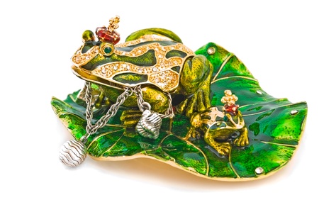 Frog- jewelry box with silver bracelet on white.の写真素材