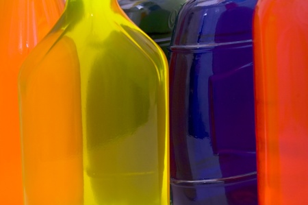 Glass bottles with different colored liquids.の写真素材