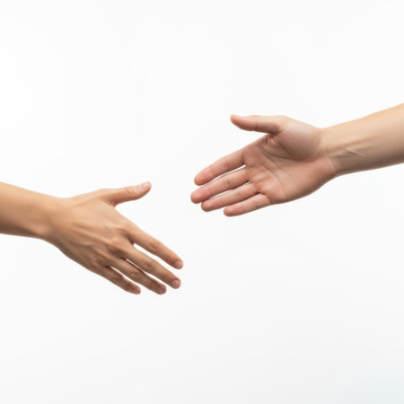 Two hands reaching out, isolated on white backgroundの素材