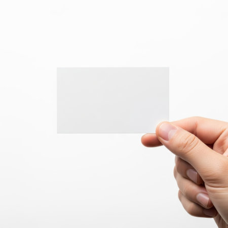 Hand holding blank card isolated on white backgroundの素材