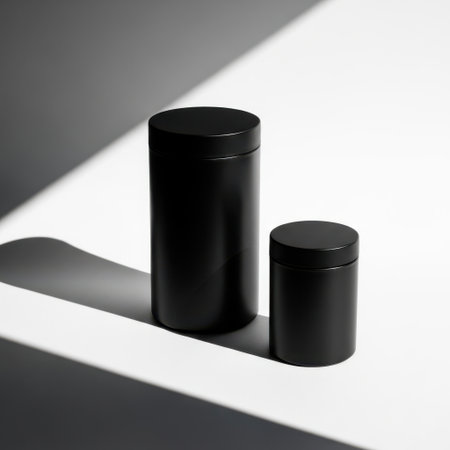 Two black cylindrical containers isolated on white backgroundの素材