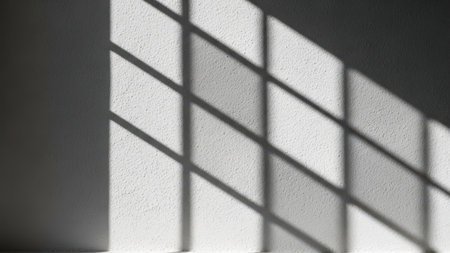 Shadow of window blinds on wall, isolated on white backgroundの素材