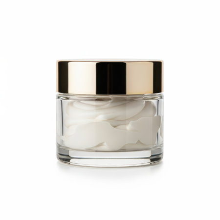 Glass cream jar with gold lid isolated on white backgroundの素材