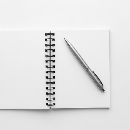 Notebook and pen isolated on white backgroundの素材
