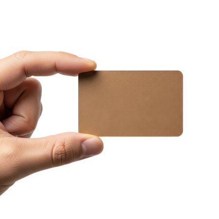 Hand holding brown card isolated on white backgroundの素材
