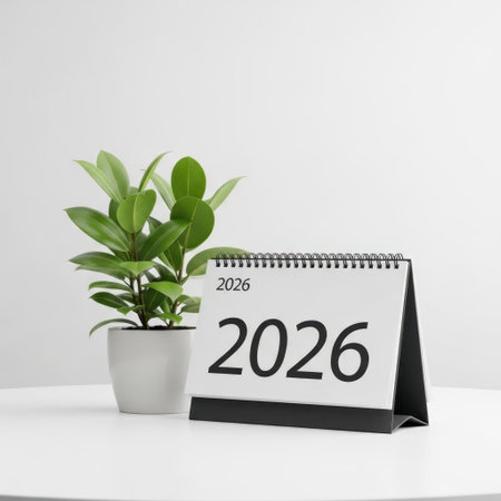 Desk calendar and plant isolated on white backgroundの素材