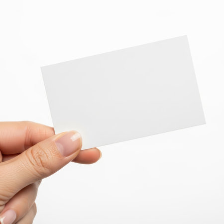 Hand holding blank card isolated on white backgroundの素材