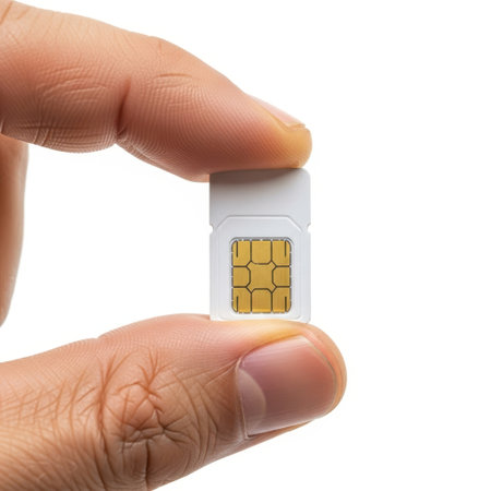 Hand holding sim card, isolated on white backgroundの素材