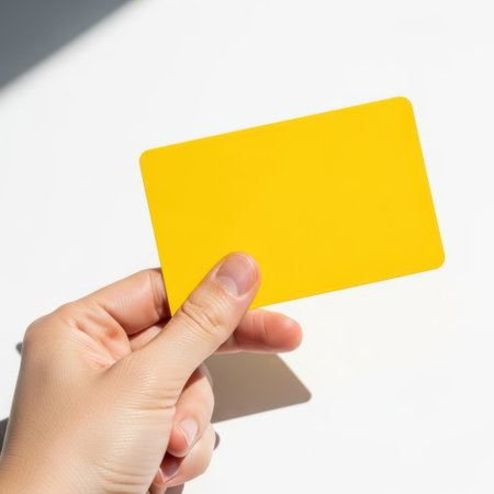 Yellow credit card isolated on white backgroundの素材