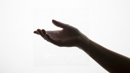 Hand reaching out, isolated on white backgroundの素材