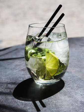 cocktail with lime , ice and peppermint leavesの写真素材