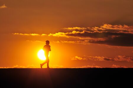 Men in the sunsetの写真素材