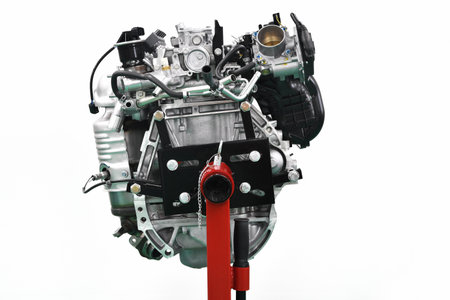 The engine of a car being serviced at the engine stand