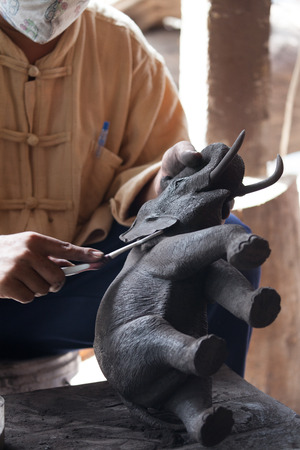 An unidentified Man builds Elephant wood at Elephant Carving Museum (Baan Jang Nak) in Chiang Mai,Thailand.のeditorial素材