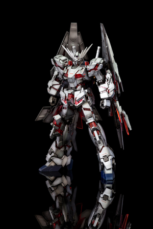 CHIANG MAI, THAILAND - JUL 10, 2016: Plastic model of Gundam from the Gundam series of Animated TV shows. The model is posed on a black background and is manufactured by Bandaiのeditorial素材