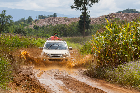 CHIANG MAI, THAILAND - OCT 2: Unknown car driver piloting his car on the tracks, Oct 2, 2016 in Chiang Mai, Thailand.のeditorial素材